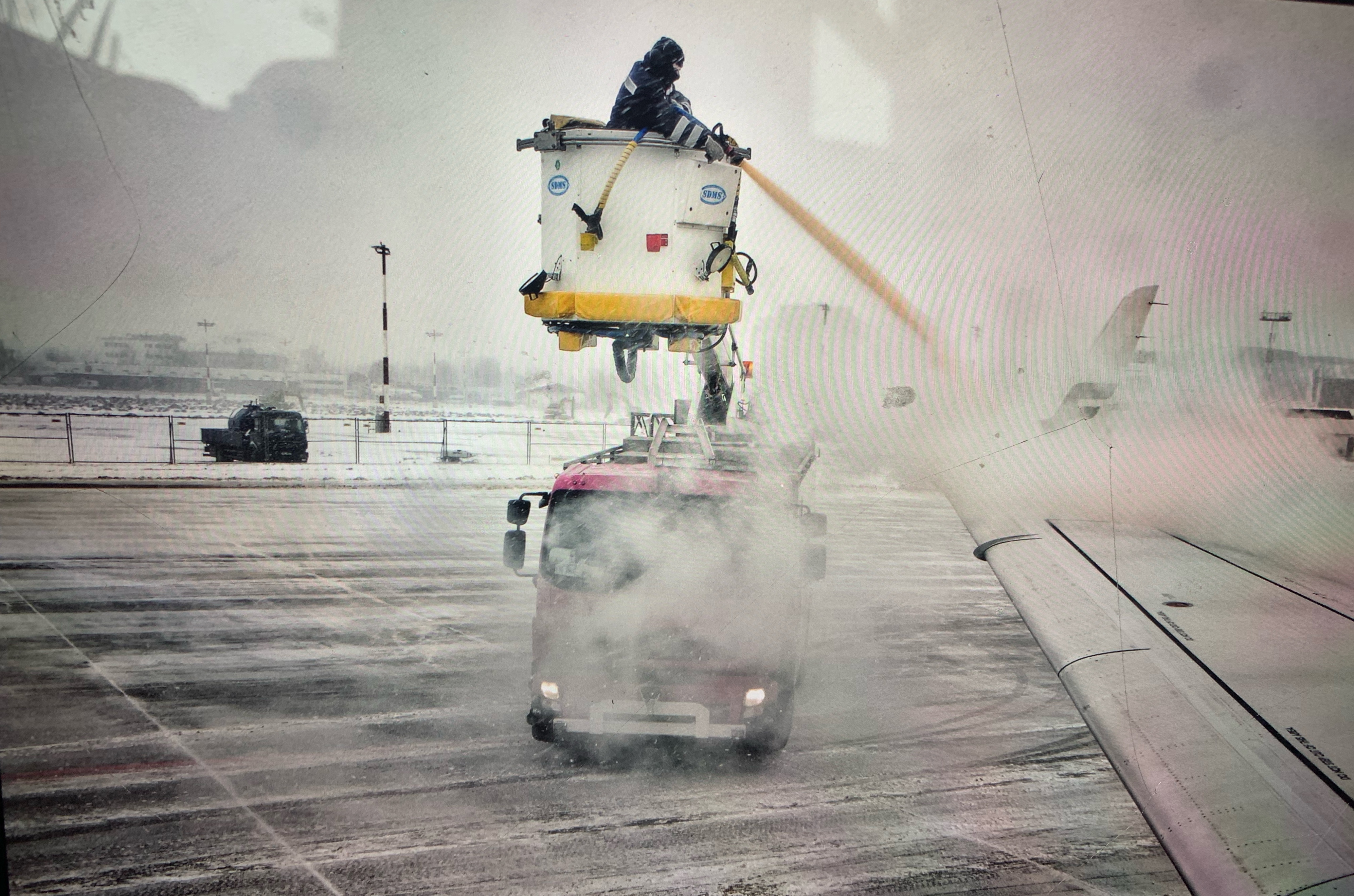 Deicing the airplane at Chopin’s Airport